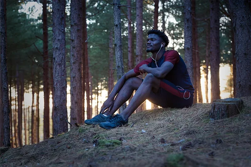 Man sitting in the forest resting