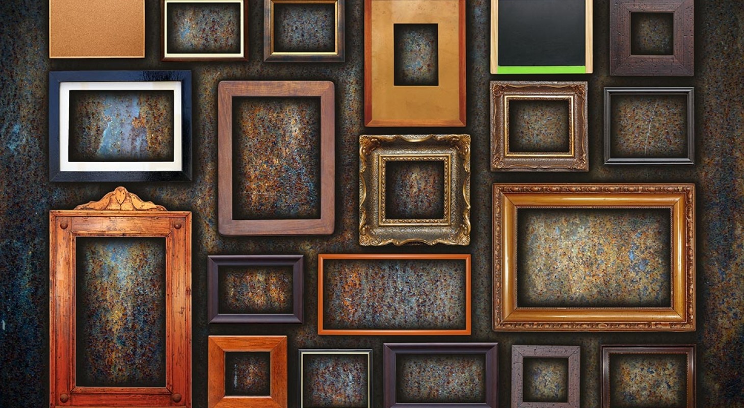 assortment of empty frames of various sizes on bronze wall