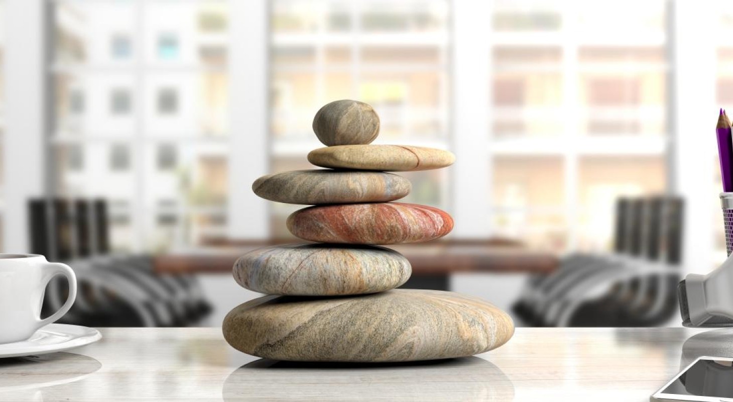 stacked-rocks-on-a-white-office-desk