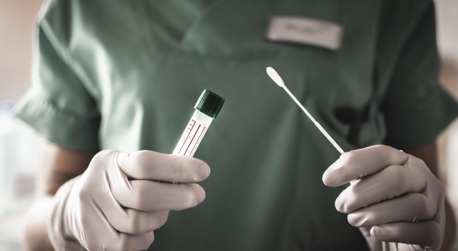 nurse-in-green-scrubs-with-coronavirus-test-swab