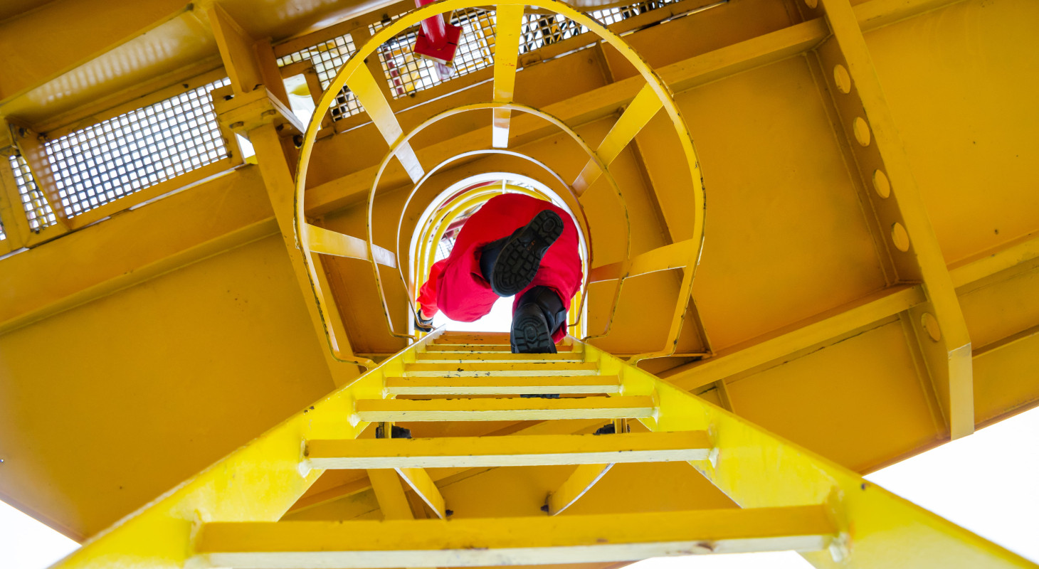 offshore oil rig worker climbing