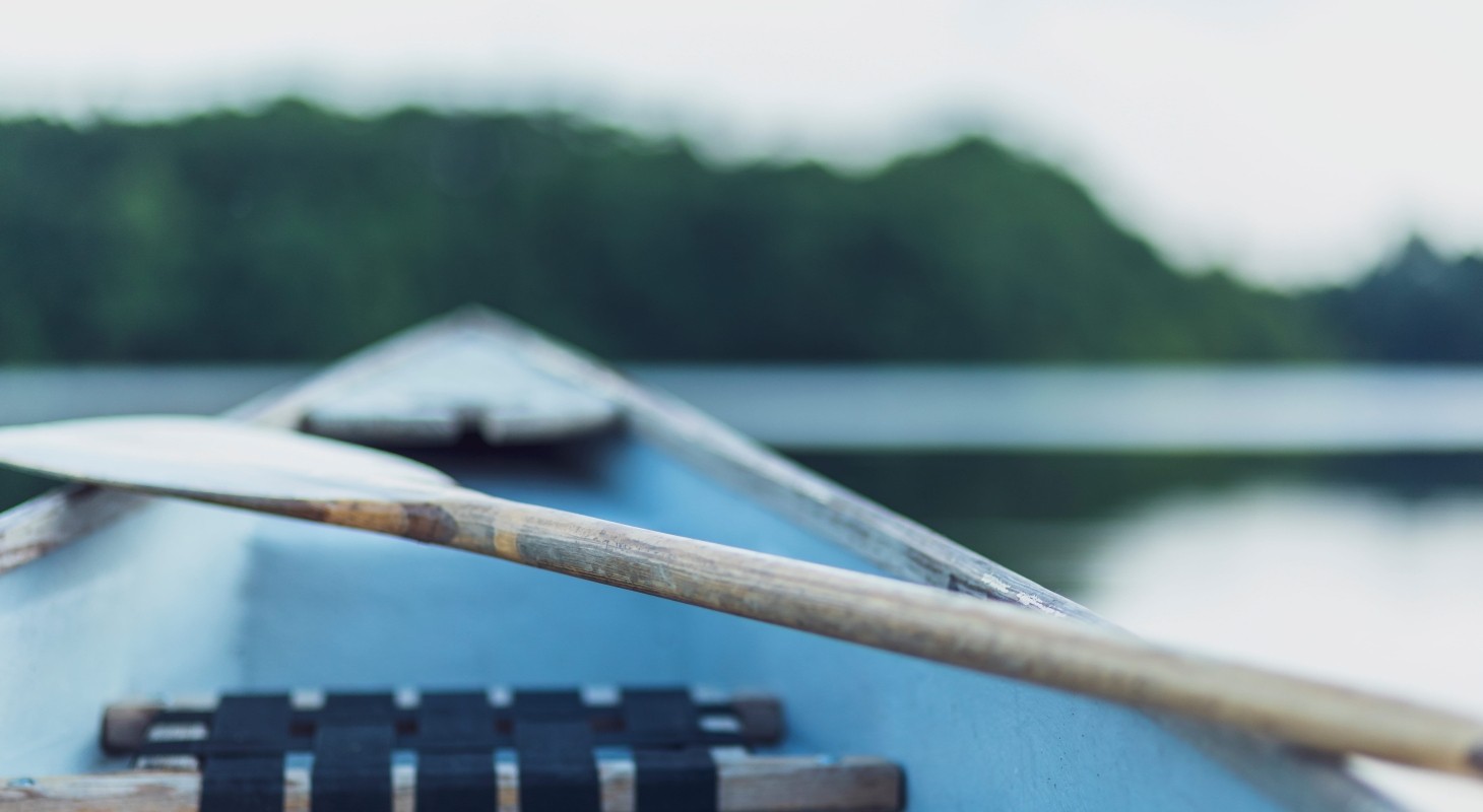 close up of a paddle and a boat