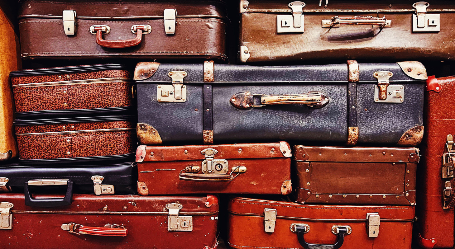 pile of vintage suitcases