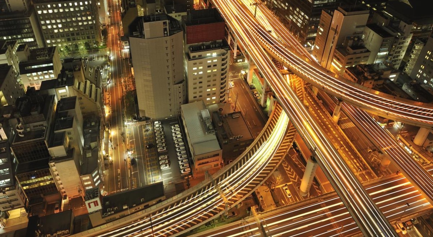 overhead view of merging highways at night