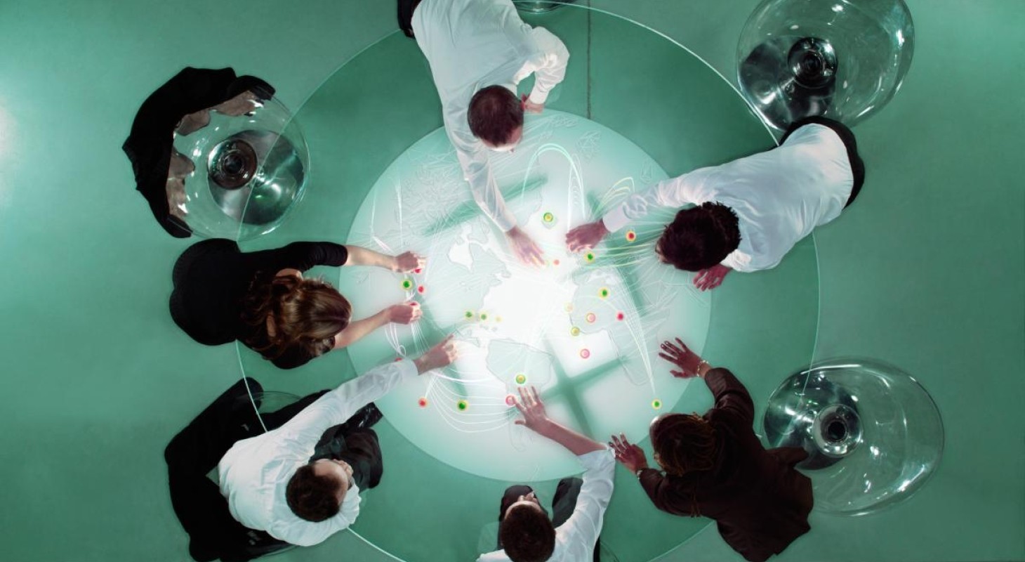 overhead-view-of-business-people-analyzing-map
