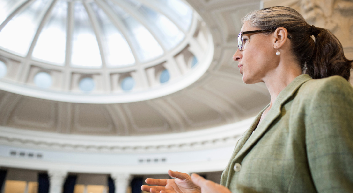 Caucasian women talking in government building 