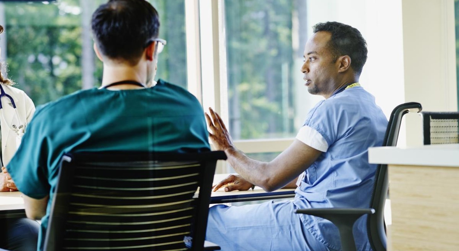 healthcare team sitting at a conference table