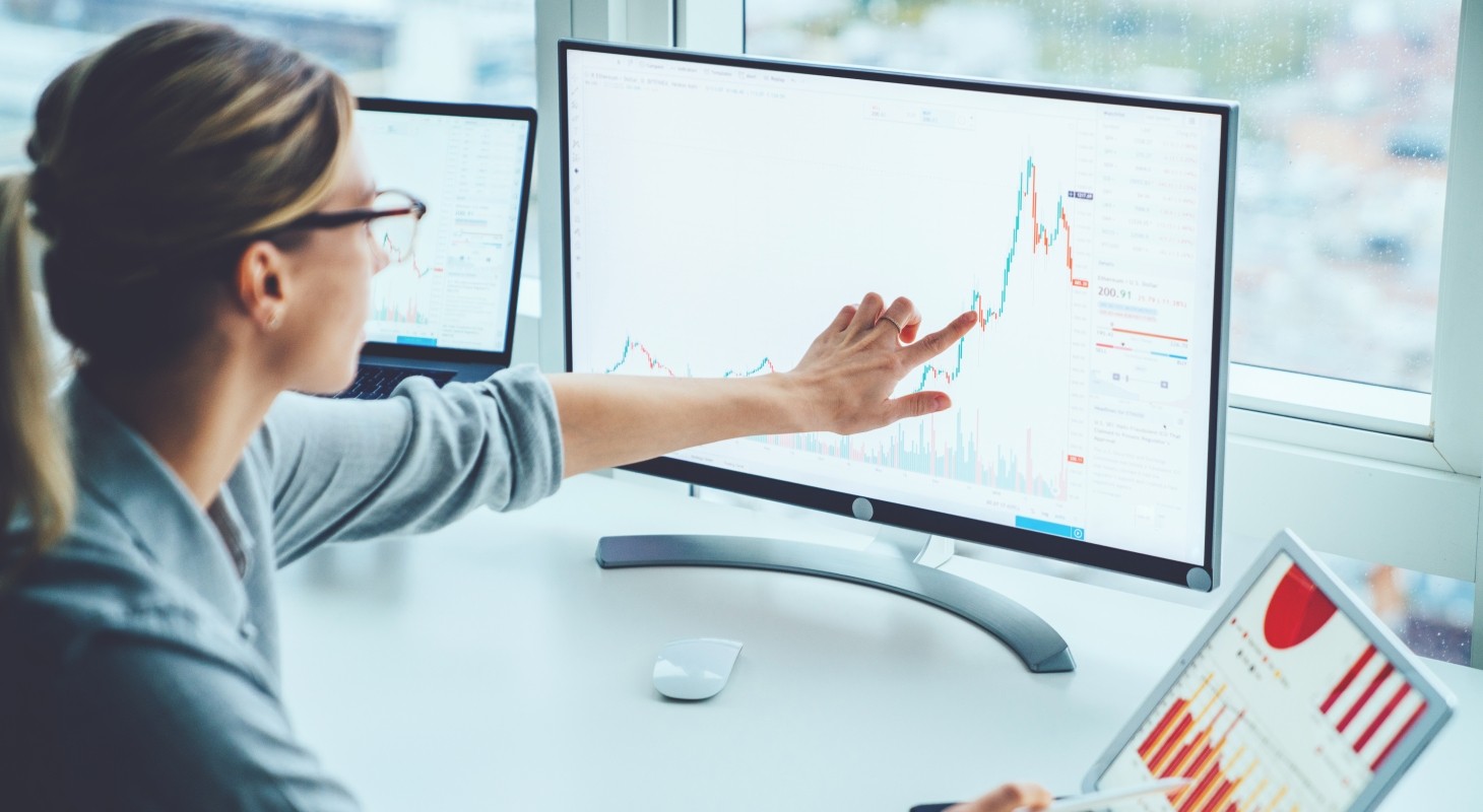 /sites/default/files/article-images/GettyImages-1170740Business woman study financial market to calculate possible risks and profits