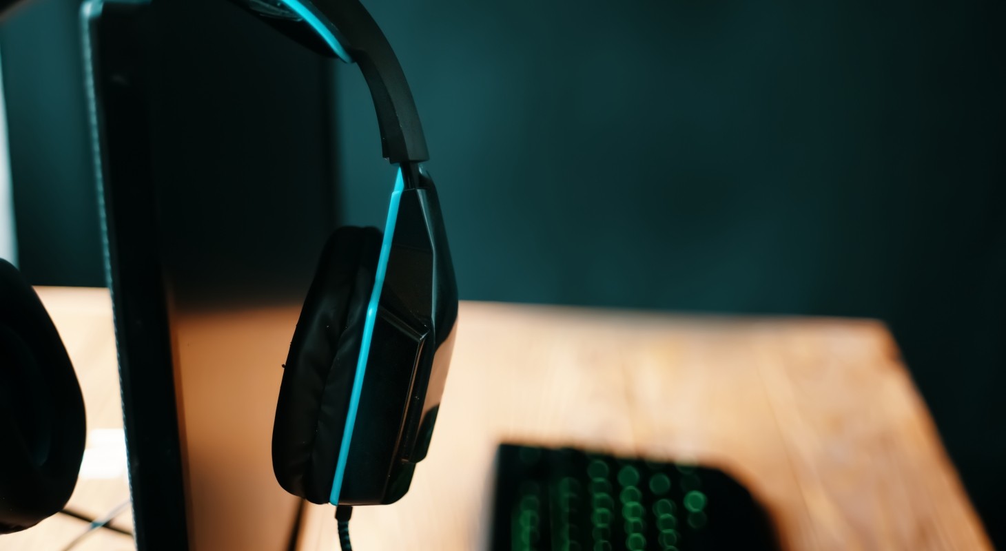 headphones hooked over monitor