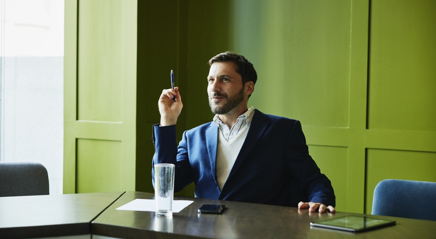 businessman listening during meeting in conference room