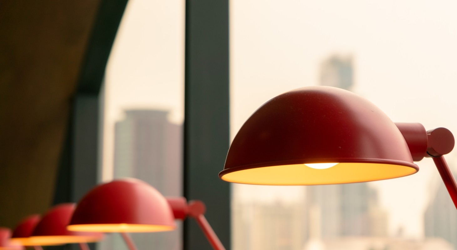 red table lamp set apart from similar lamps