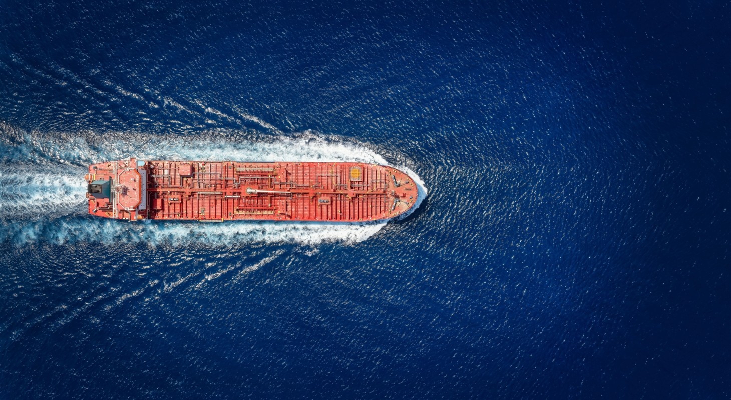 high aerial top view of a crude oil tanker traveling with speed