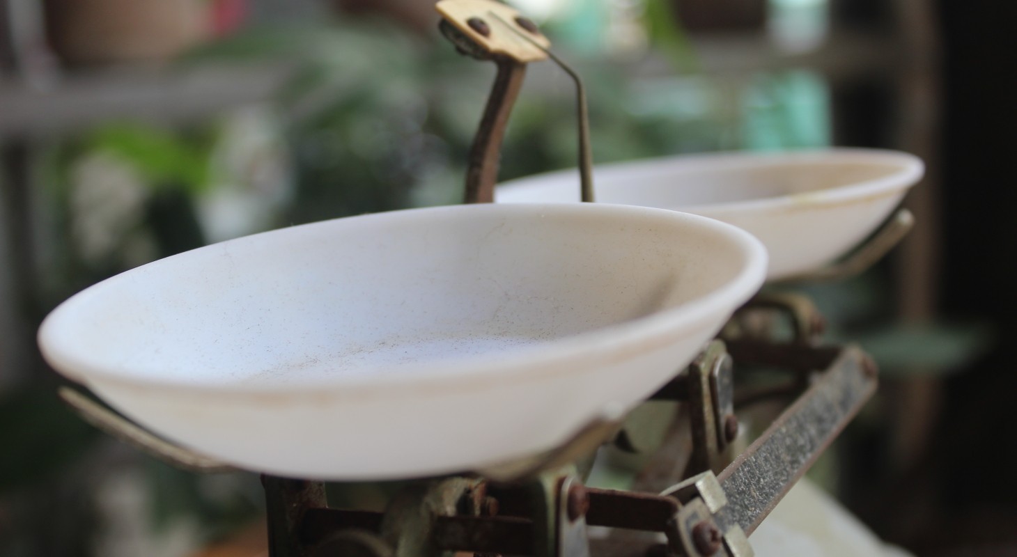 old iron weight scales with white bowls