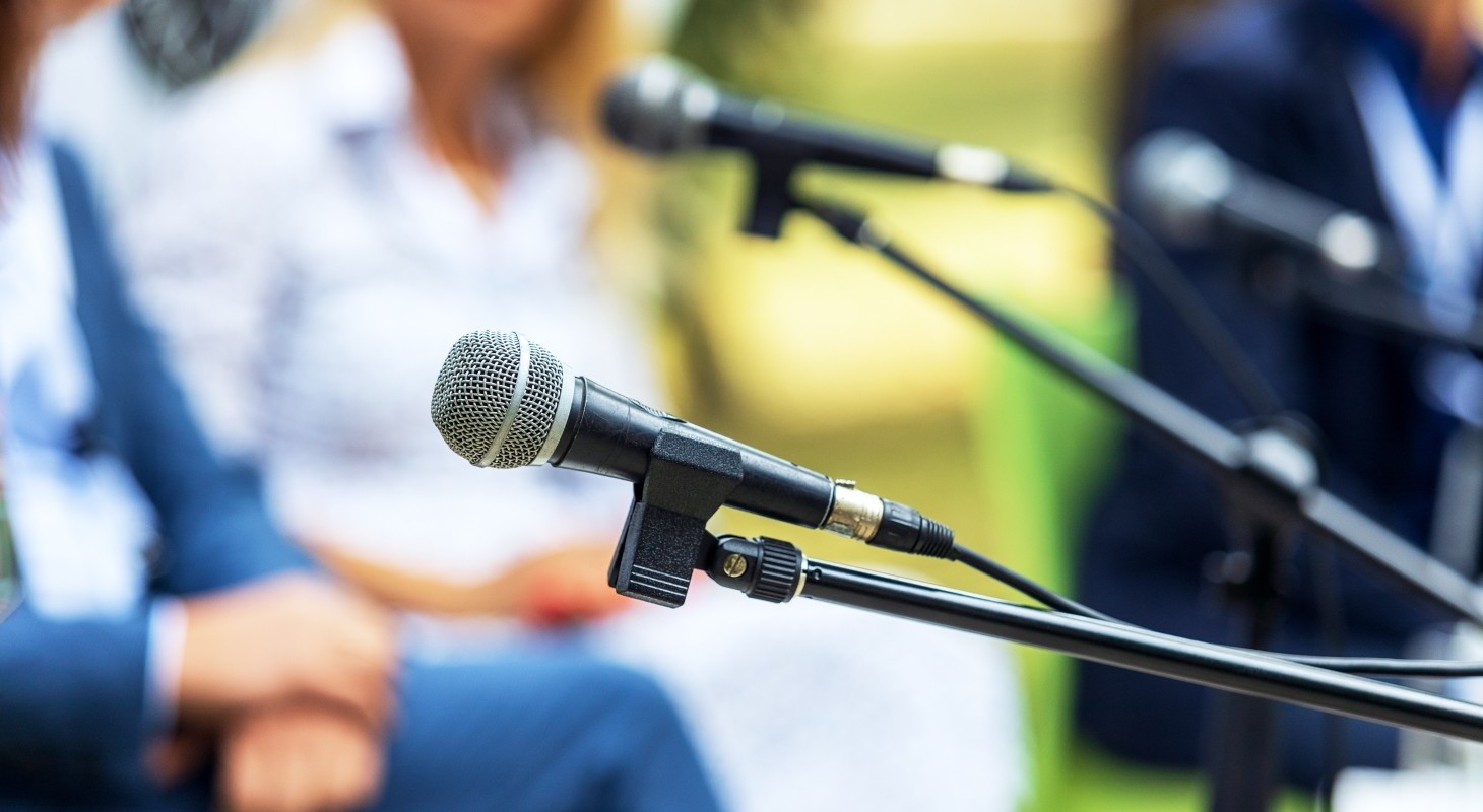 unfocused image of executives at roundtable event