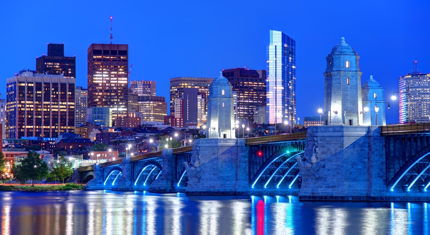 nighttime view of longfellow bridge going into kendall square