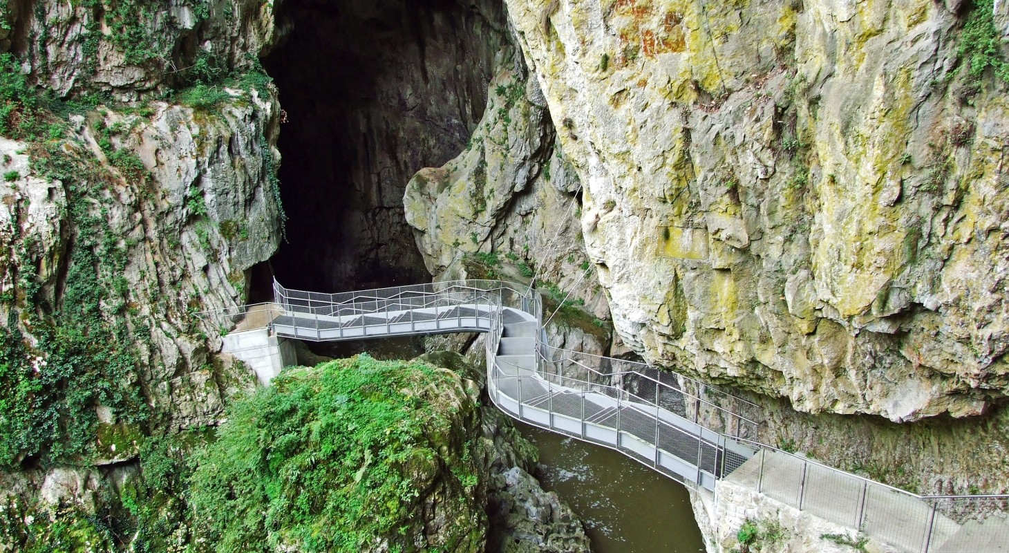mountain chasm connected by foot bridge