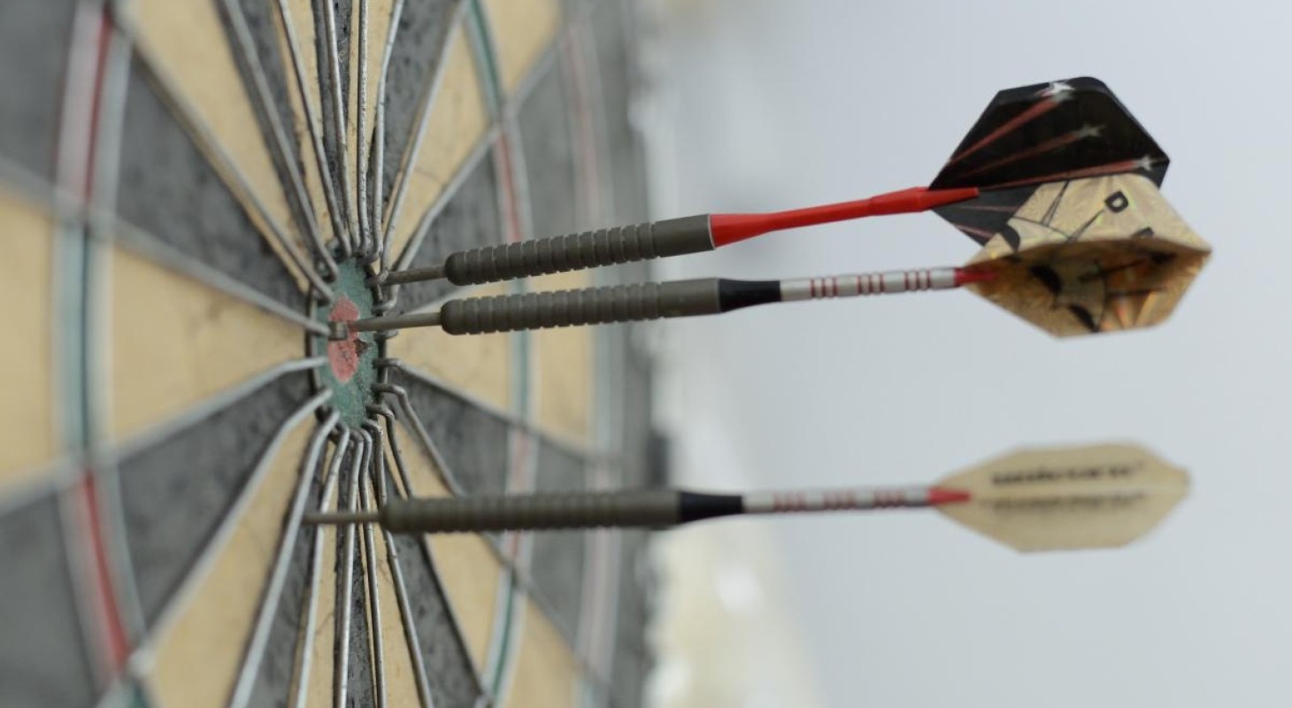 three darts on dartboard