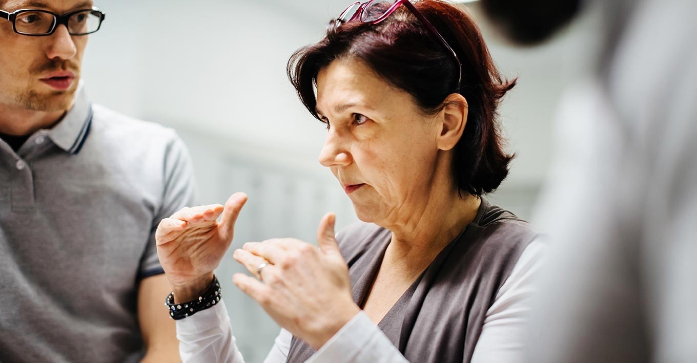 woman explaining to a group