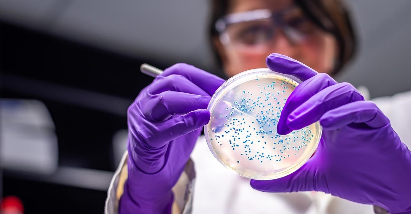 woman doing research with a test tube