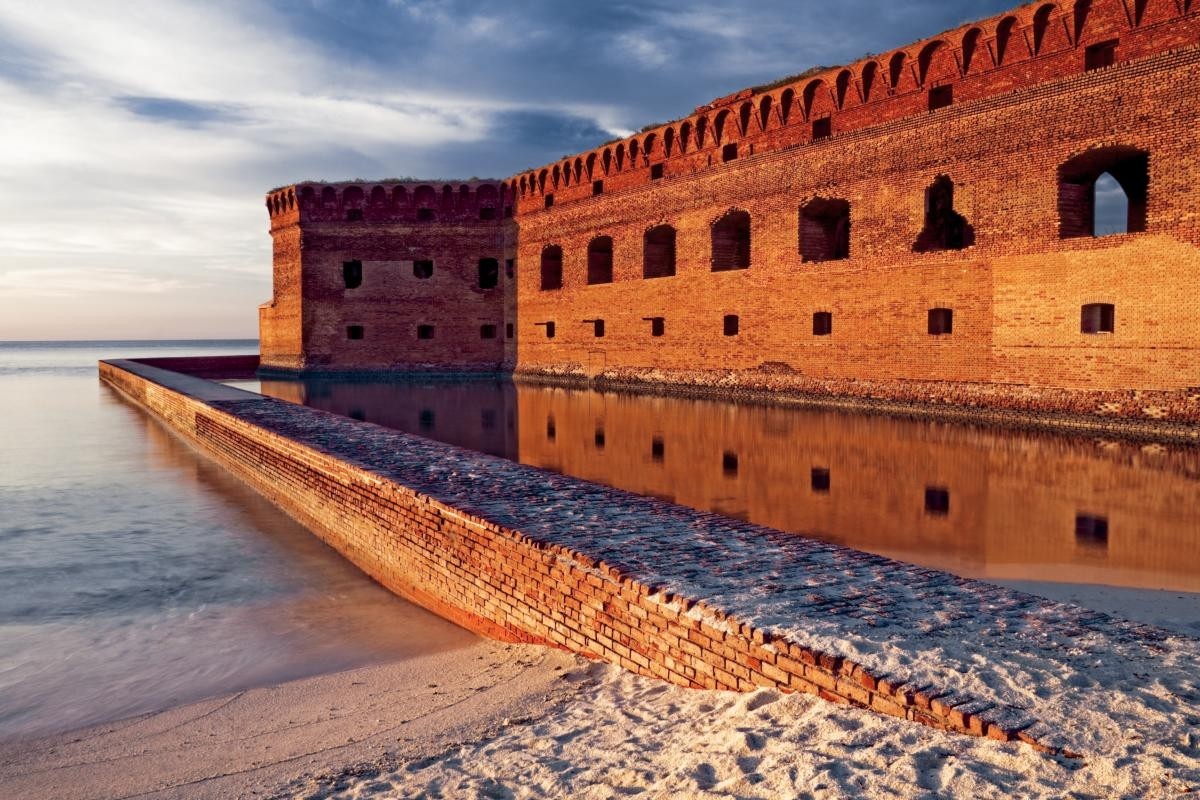 Ocean front fort with brick moat at sunset