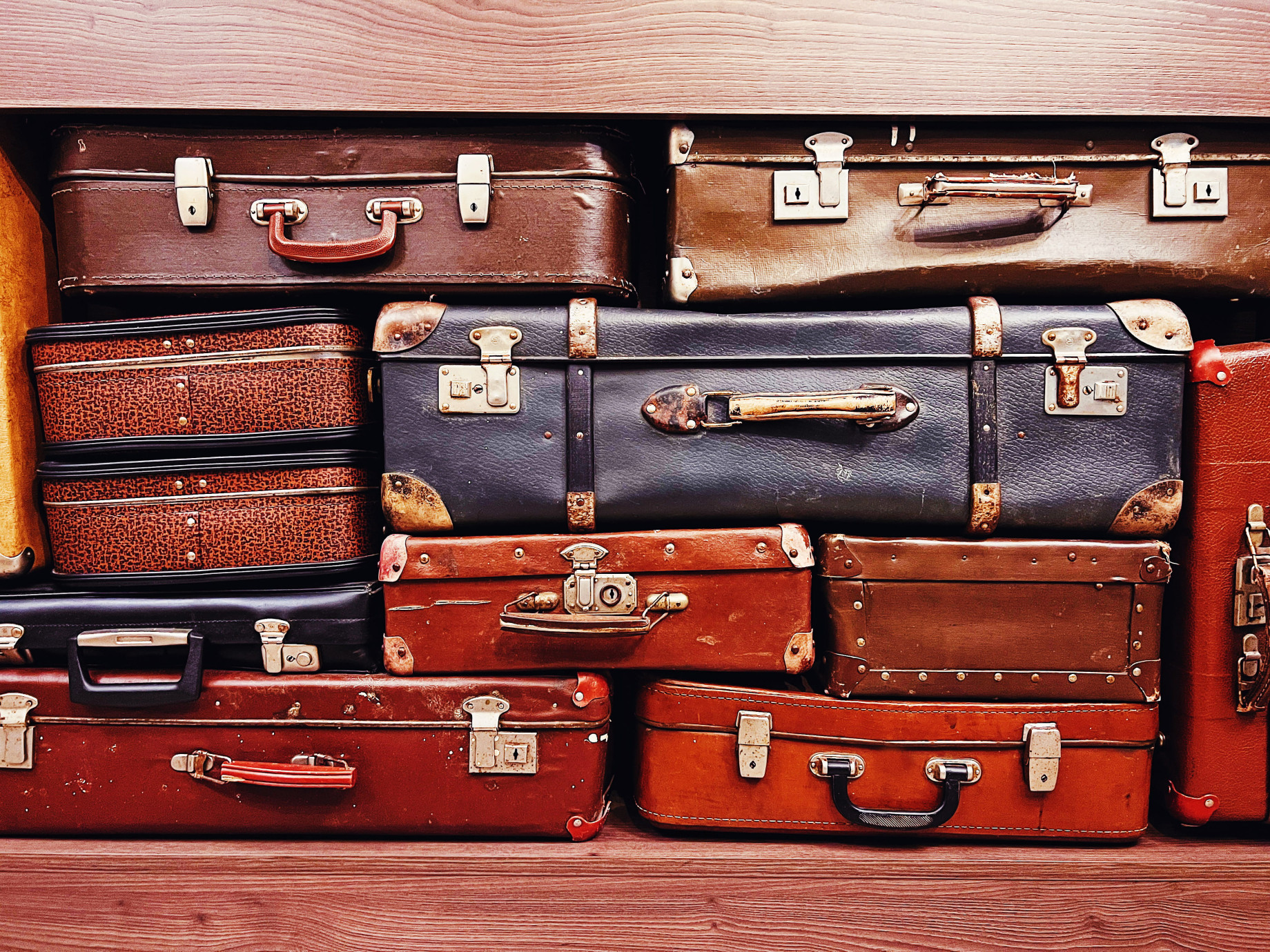 pile of vintage suitcases