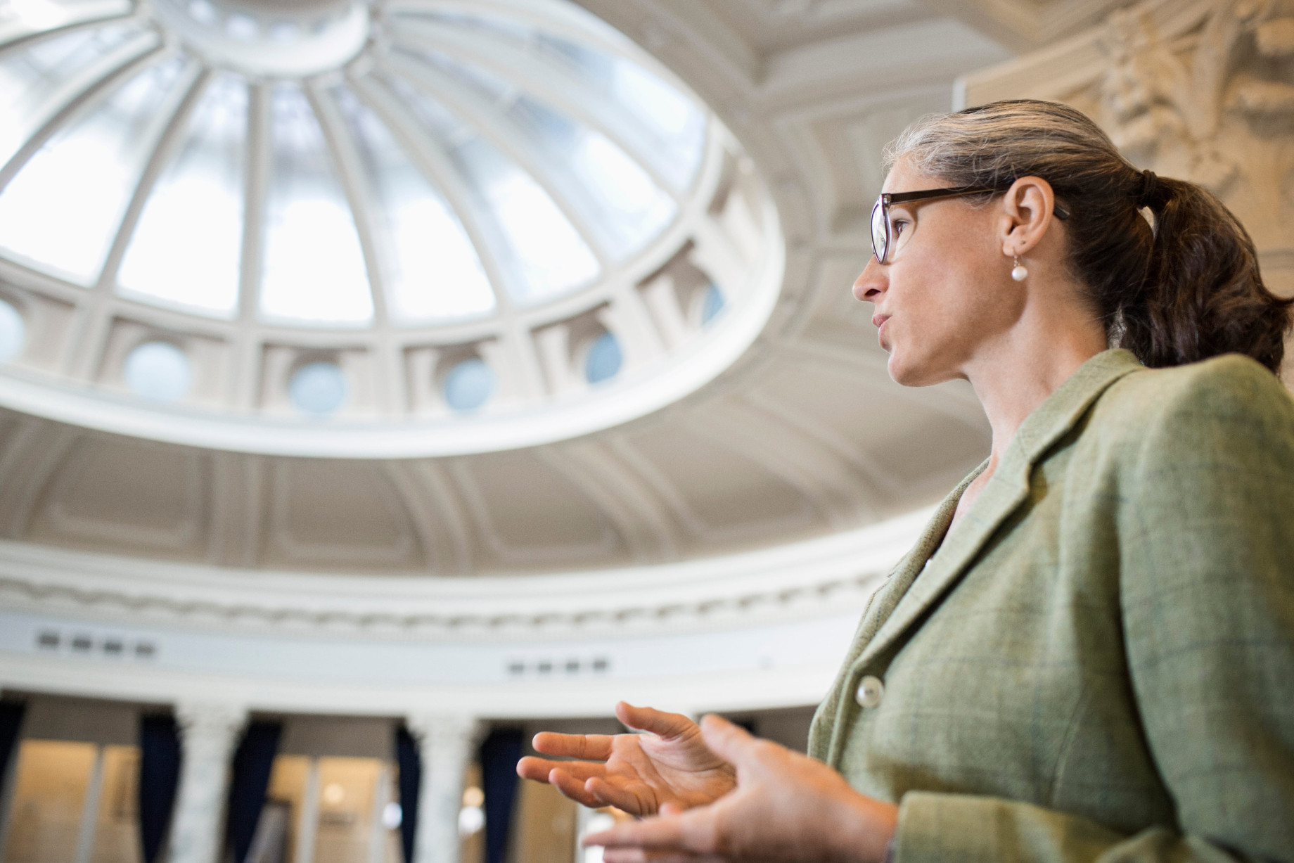 Caucasian women talking in government building 