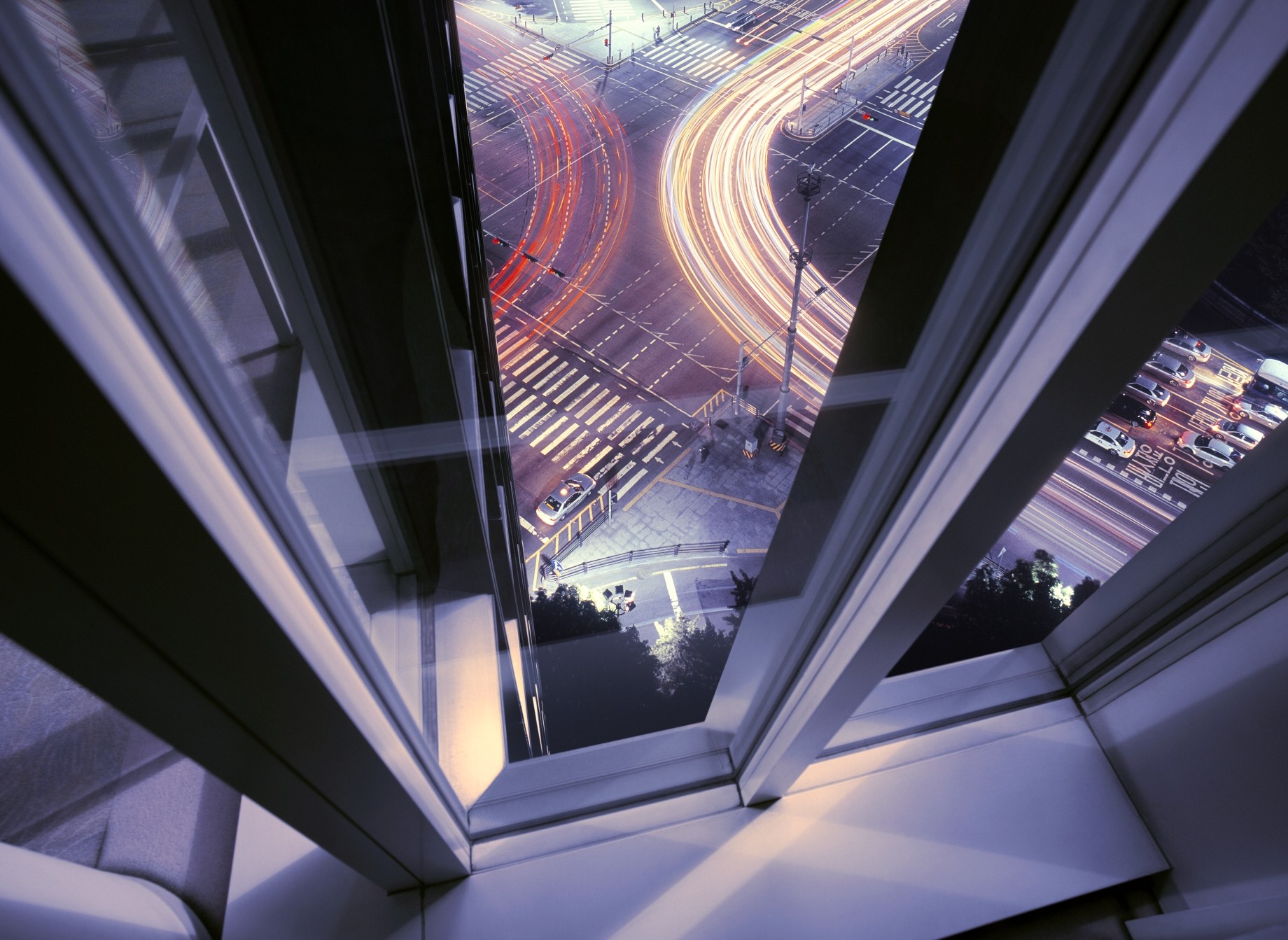 window view from office building of busy road junction