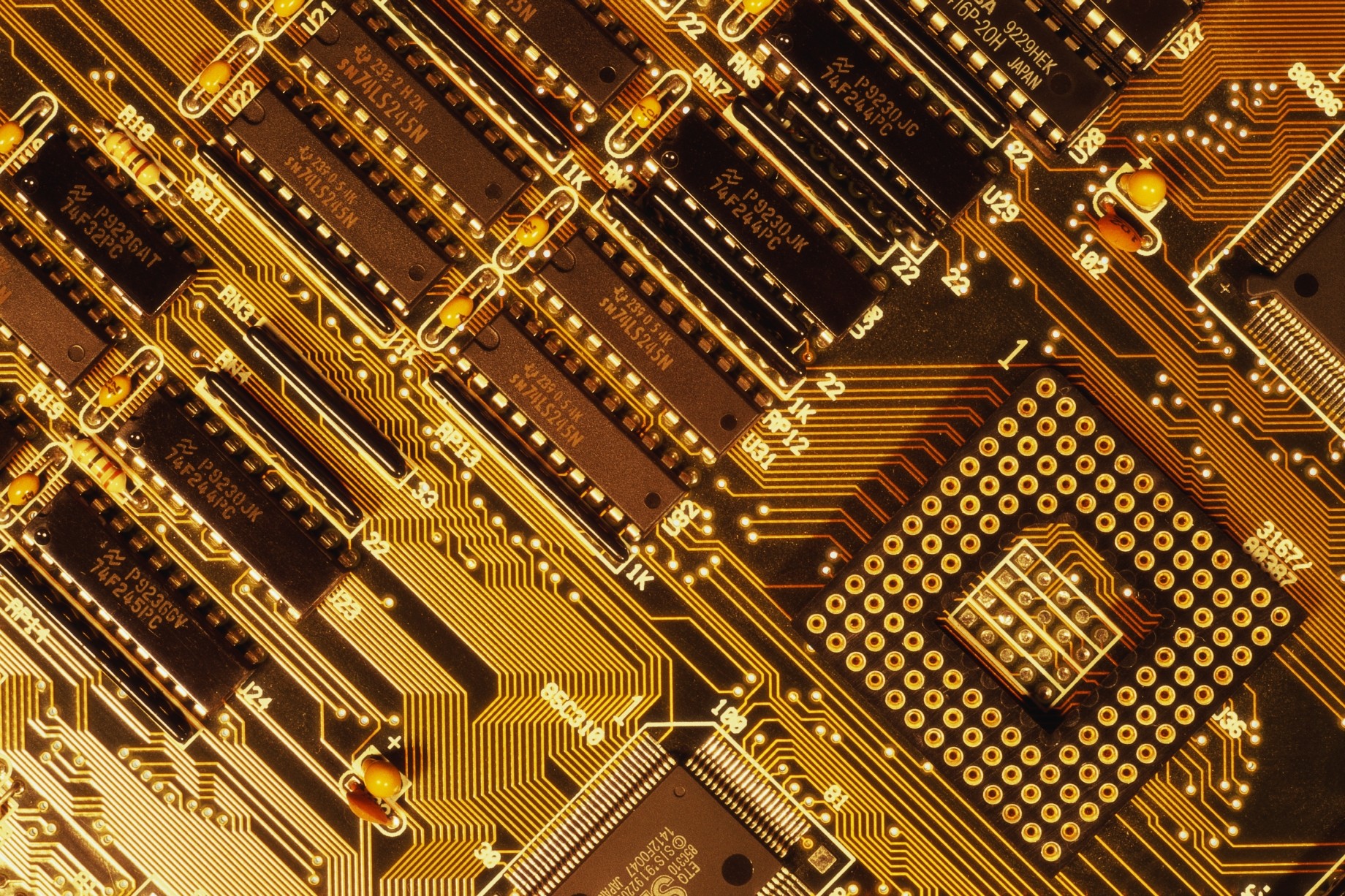tight zoom on motherboard with chips and memory