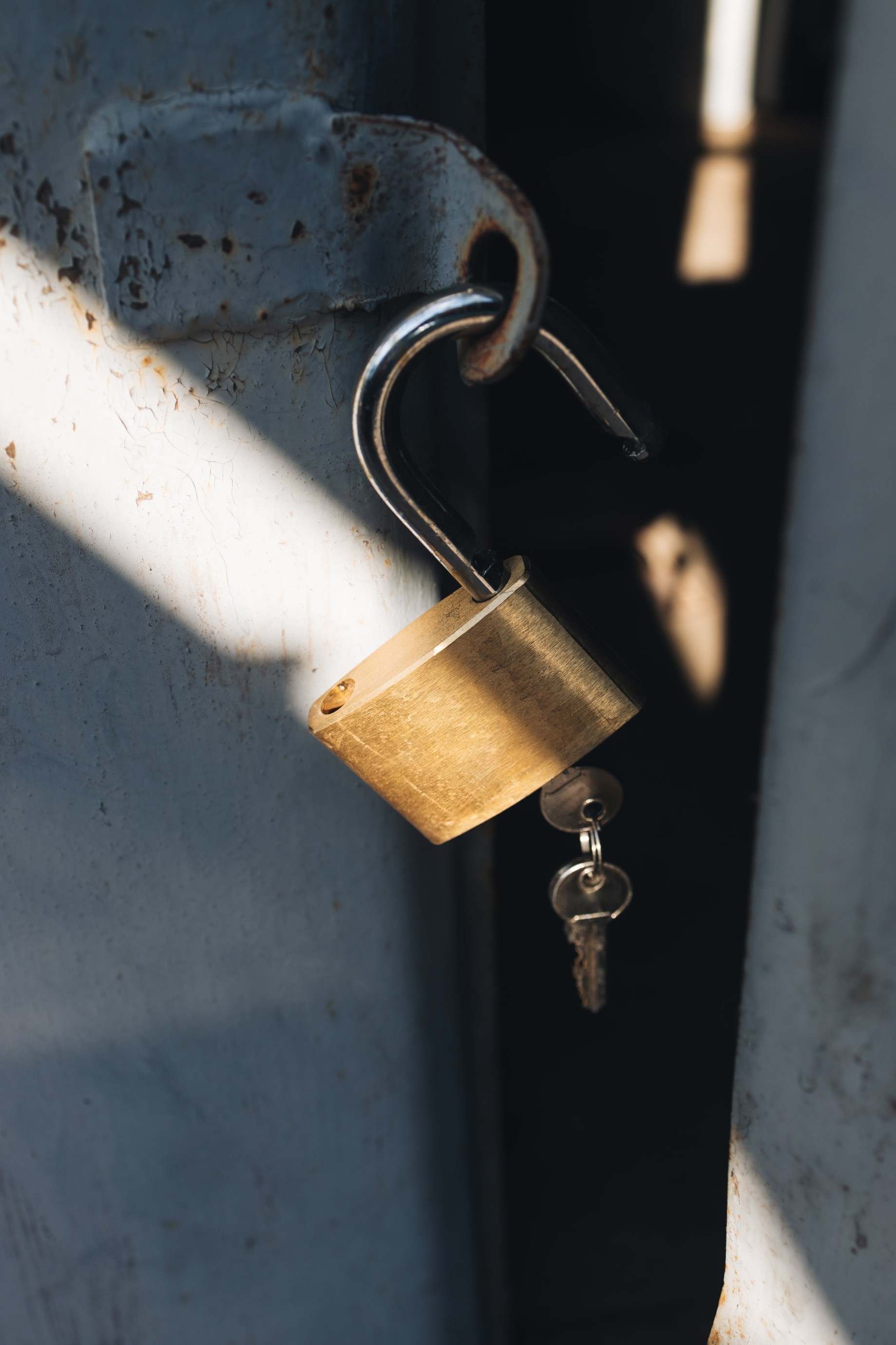 medal padlock with two keys on old garage door