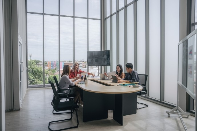 business team having meeting in bright modern conference room