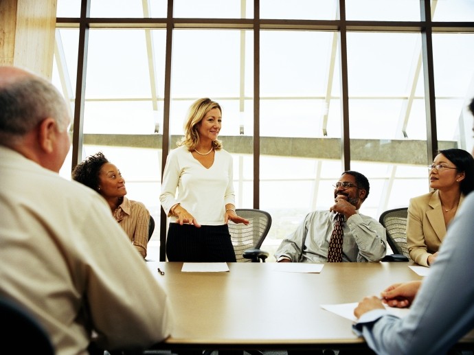 Group-of-professionals-having-meeting-in-boardroom