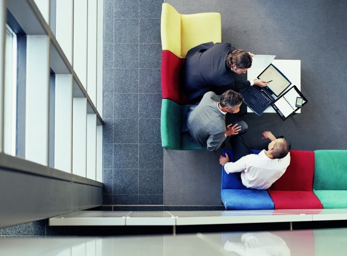 three businessmen in meeting, overhead view