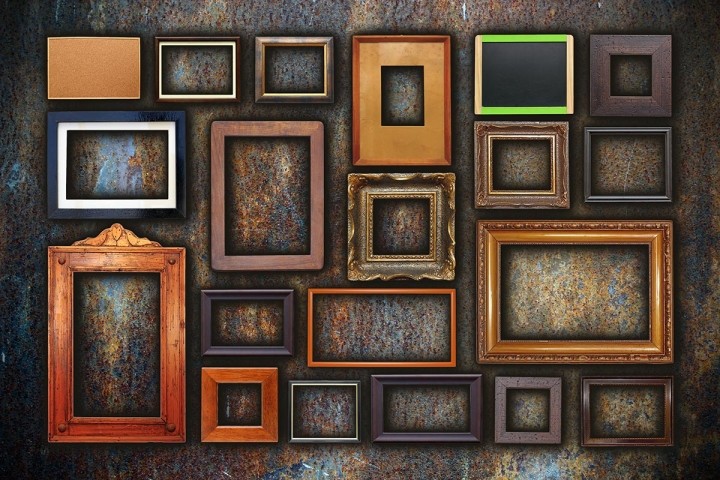 assortment of empty frames of various sizes on bronze wall