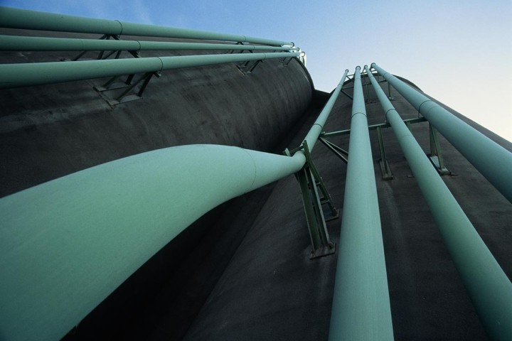 low angle view of parallel green pipes