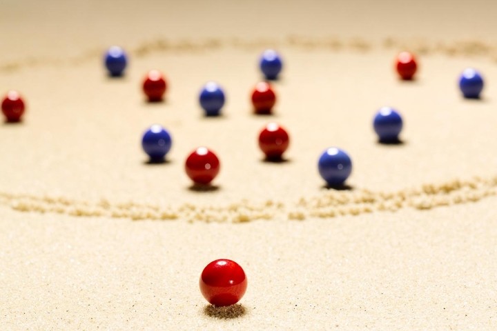 close up of red and blue marbles