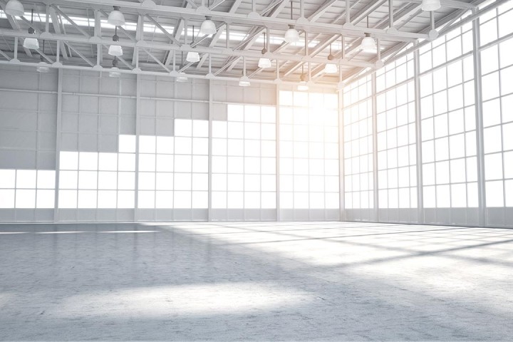 empty modern white warehouse with staggered windows