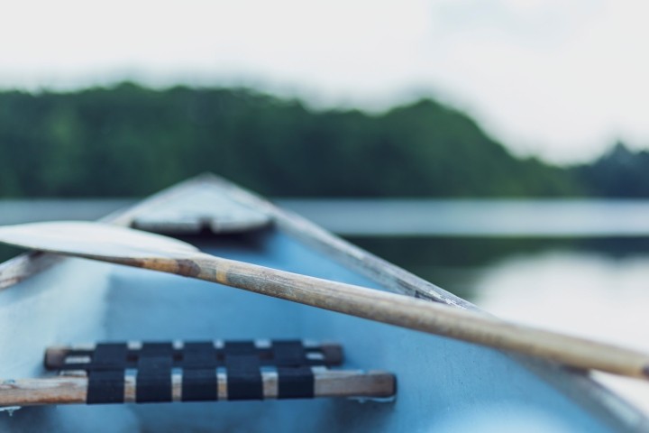close up of a paddle and a boat