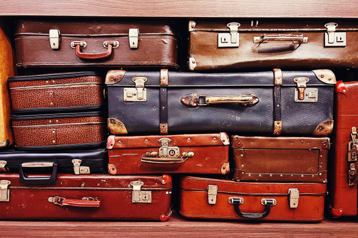 pile of vintage suitcases