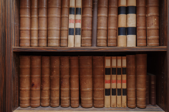 vintage law books on wooden shelves