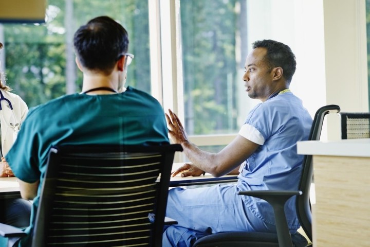 healthcare team sitting at a conference table