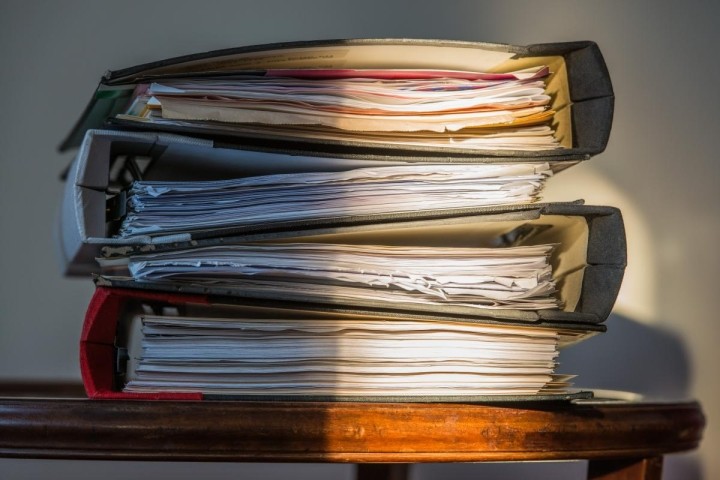 old three ring binders with worn papers