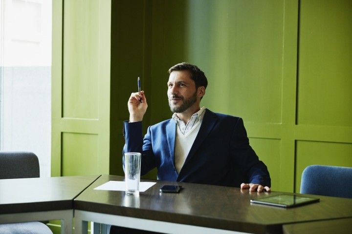 businessman listening during meeting in conference room