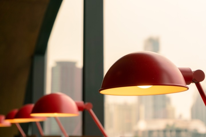 red table lamp set apart from similar lamps