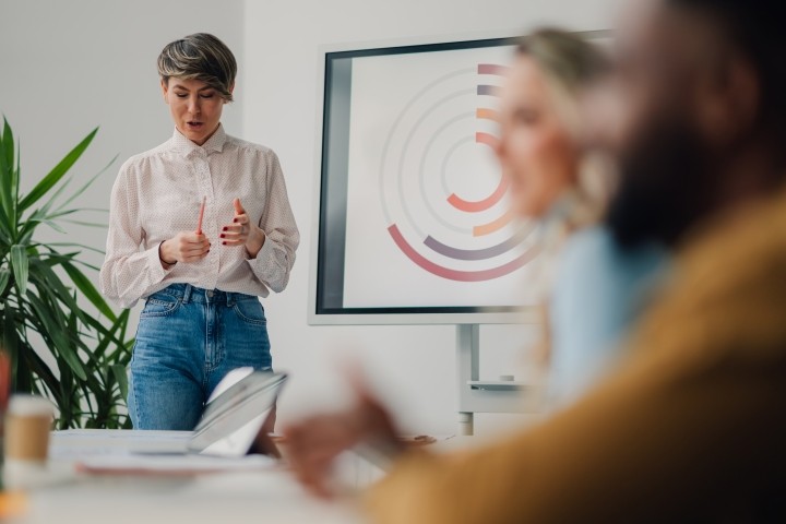 woman giving casual presentation to colleagues
