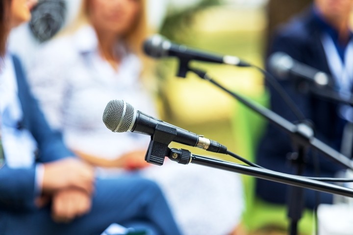 unfocused image of executives at roundtable event