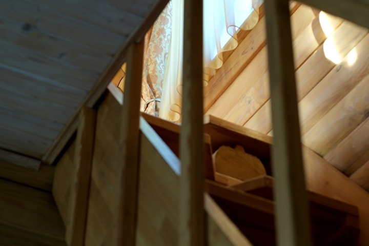 wooden staircase with window light