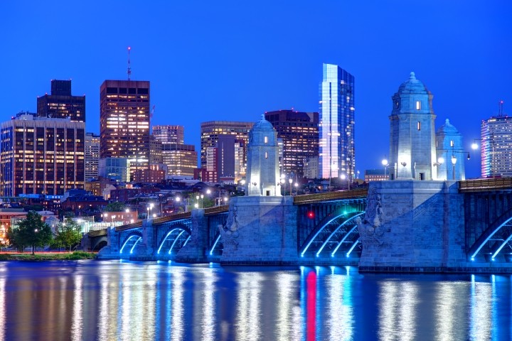 nighttime view of longfellow bridge going into kendall square