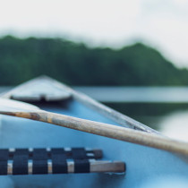 close up of a paddle and a boat