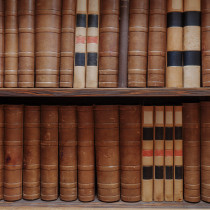 vintage law books on wooden shelves