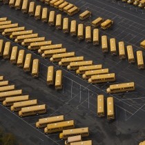 school buses in parking lot view from above